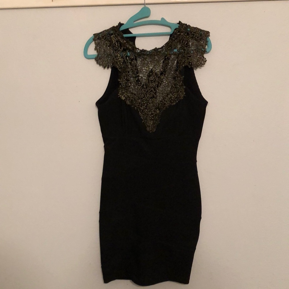 Cute little black dress with gold accents